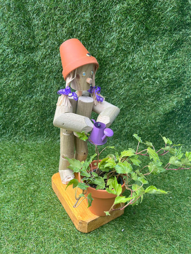 Little Girl or Boy holding a watering can