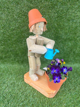 Little Girl or Boy holding a watering can