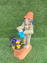Little Girl or Boy holding a watering can