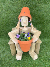Girl or boy sitting on a chair