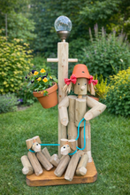 Boy or Girl stander with their two dogs&solar light
