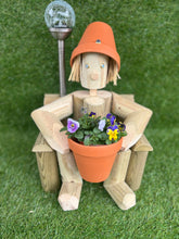 Girl or boy sitting on a chair with solar light