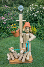 Boy or Girl stander with their two dogs&solar light