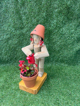 Little Girl or Boy holding a watering can