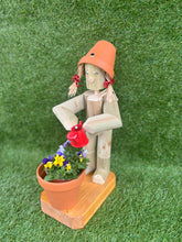 Little Girl or Boy holding a watering can