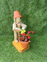 Little Girl or Boy holding a watering can