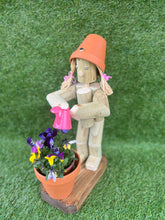 Little Girl or Boy holding a watering can