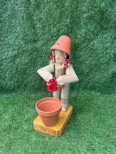 Little Girl or Boy holding a watering can
