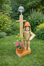 Little girl or boy with a tall lamp post