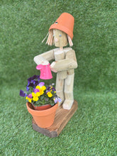Little Girl or Boy holding a watering can