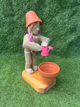 Little Girl or Boy holding a watering can