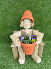 Girl or boy sitting on a chair