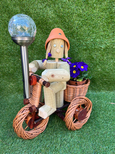 Girl or Boy on small a bright wicker bike with solar light
