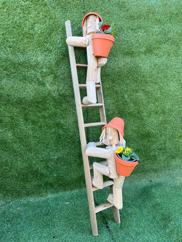 Couple climbing a ladder