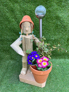 Standing girl with a pot and solar light