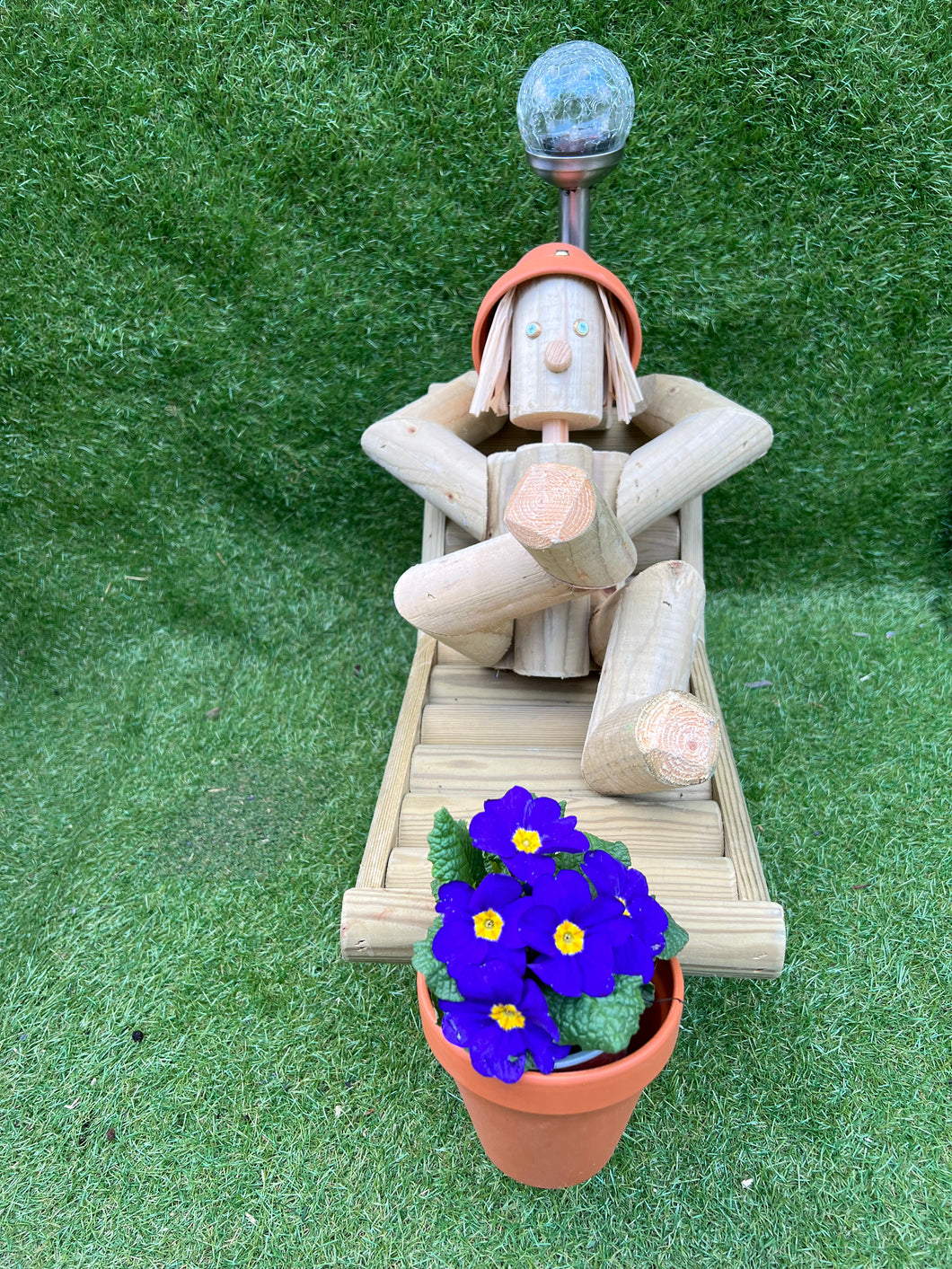 Man on a deck chair with a solar lamp