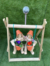 Couple on a swing with a solar lamp