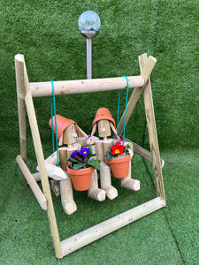 Couple on a swing with a solar lamp